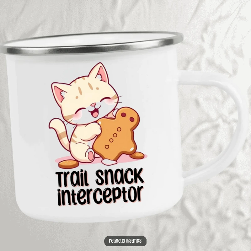 Funny camping mug with a cute cat, wagging tail, playfully batting at a tumbling gingerbread cookie, for festive outdoor moments.