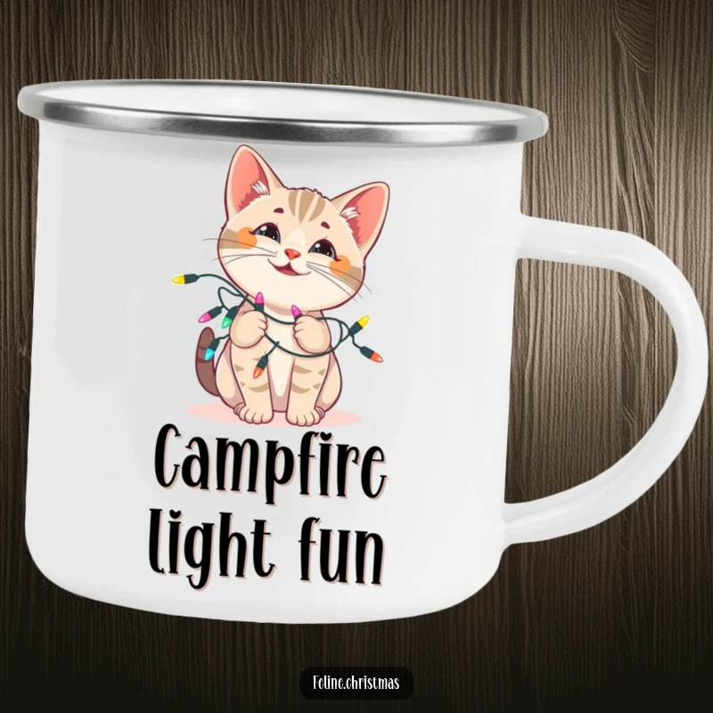 Funny cat camping mug: enamel mug with a playful kitten tangled in festive Christmas lights, ideal for bright outdoor times.
