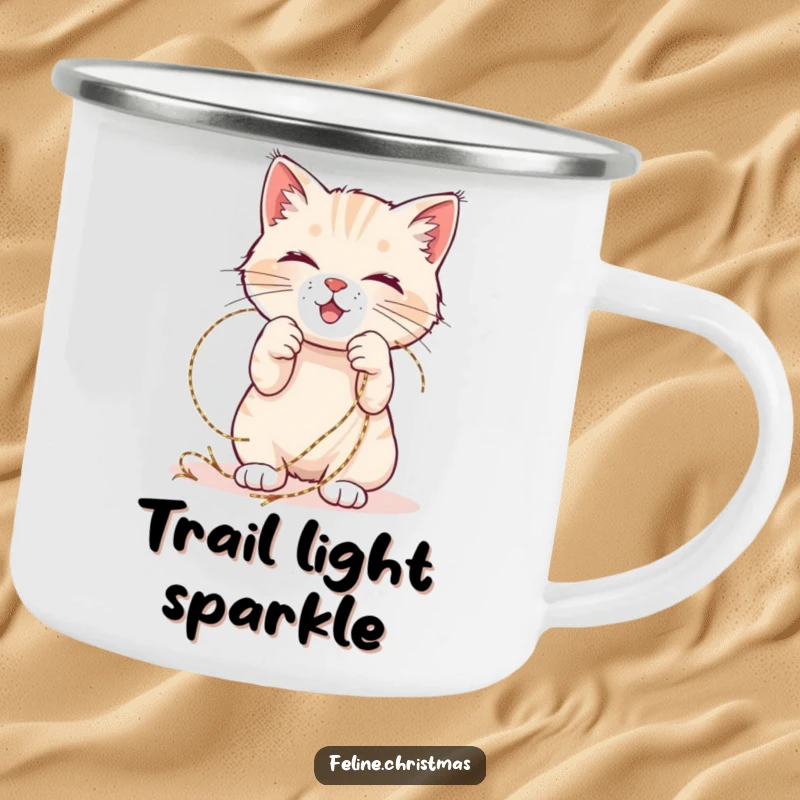Funny Christmas camping mug with a happy cat playfully tangled in shimmering tinsel for outdoor enjoyment.
