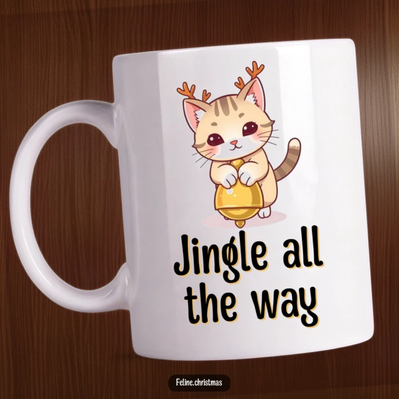 Funny Cat Antlers Mug showing a playful cat with antlers pouncing on a jingle bell, festive and cute.
