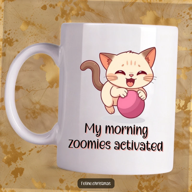 Funny Siamese cat mug depicting a playful feline gleefully chasing a festive bauble, radiating pure holiday joy and mischief.