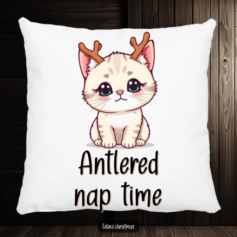 Funny kawaii cat wearing tiny reindeer antlers with a curious expression, on a soft and decorative pillow.