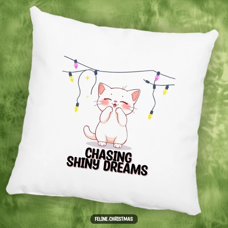 Funny white cat batting playfully at a dangling string of lights, a plush pillow for festive fun.