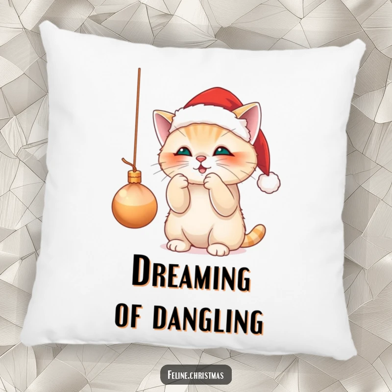 Funny pillow with a cute cat in a Santa hat, playfully batting at a dangling Christmas ornament, ideal for cozy holiday vibes.