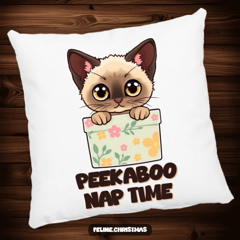 Funny pillow with a Siamese cat peeking out of a decorated gift box with wide eyes, perfect for cozy holiday decoration.