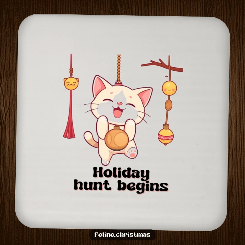 Funny Christmas coaster with a cat gleefully pouncing on a dangling ornament, protects surfaces with festive and humorous style.