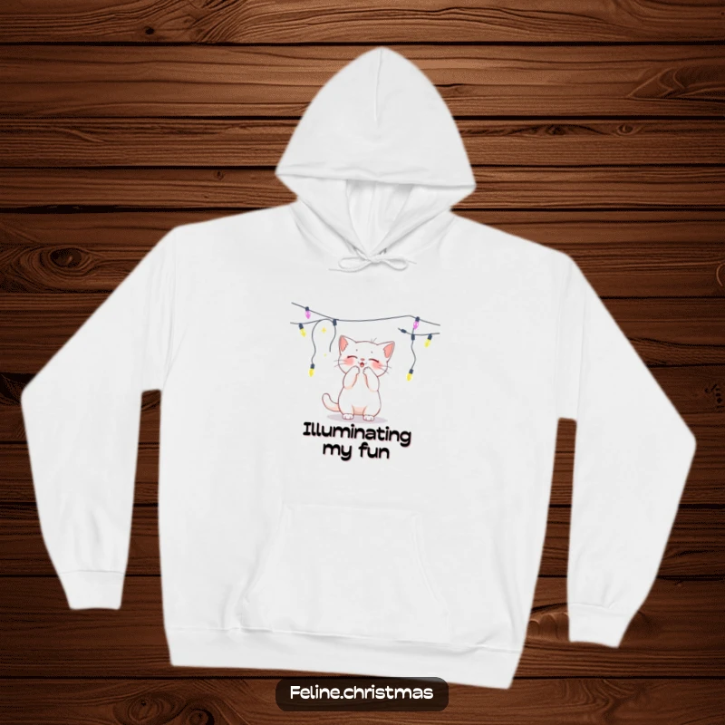 Funny white cat batting playfully at a dangling string of lights, a cozy and humorous hoodie.