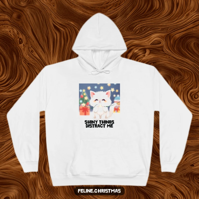 Funny Kawaii Fluffy White Cat Hoodie: A cute cat batting at sparkling Christmas lights, embodying festive holiday playfulness.