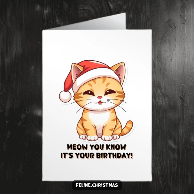 Funny Free Printable Birthday Card: Mischievous cat in Santa hat, playfully batting, ready for fun.
