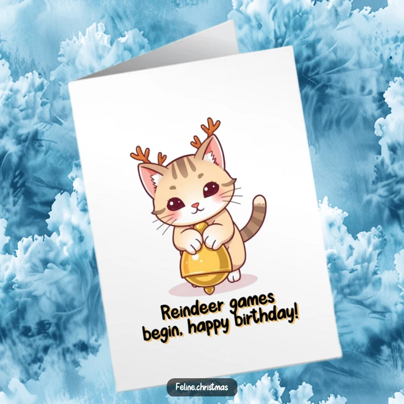 Funny Free Printable Birthday Card: A cat with tiny antlers playfully pounces on a jingle bell, ready for holiday fun.