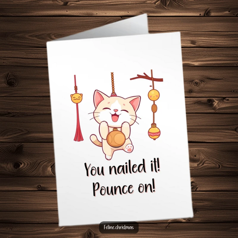 Funny Free Printable Congratulations Card: Cat gleefully pouncing, catching success like a dangling ornament.