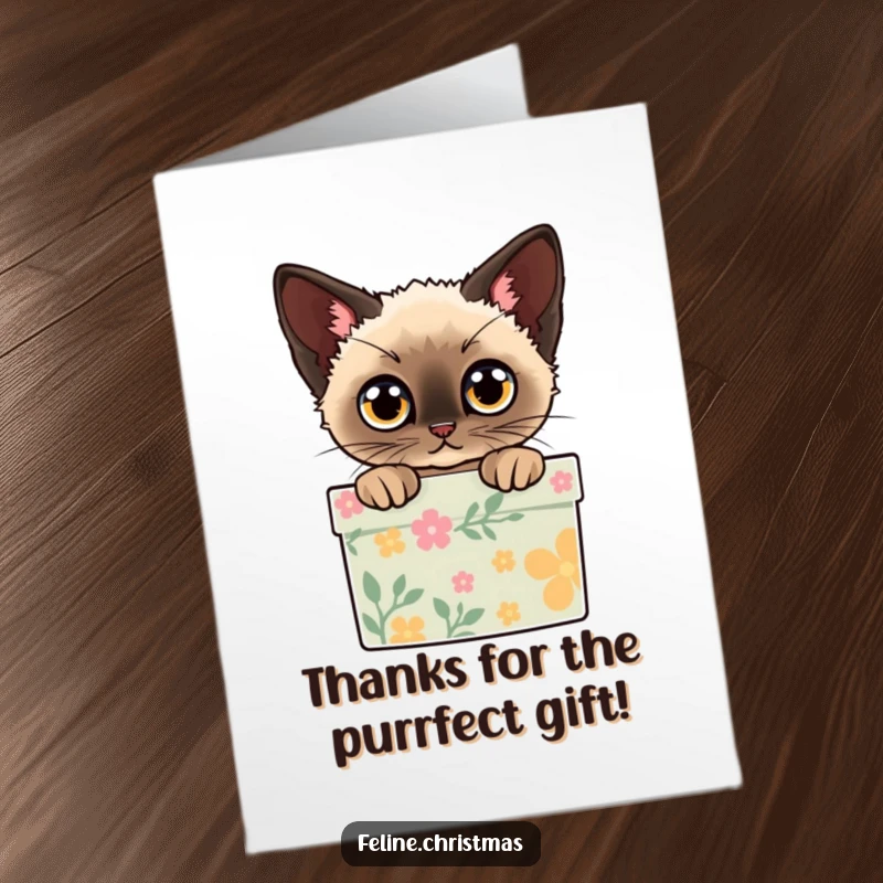 Funny Free Printable Thank You Card: A Siamese cat with wide eyes peeks out from a decorated gift box, offering thankful curiosity.
